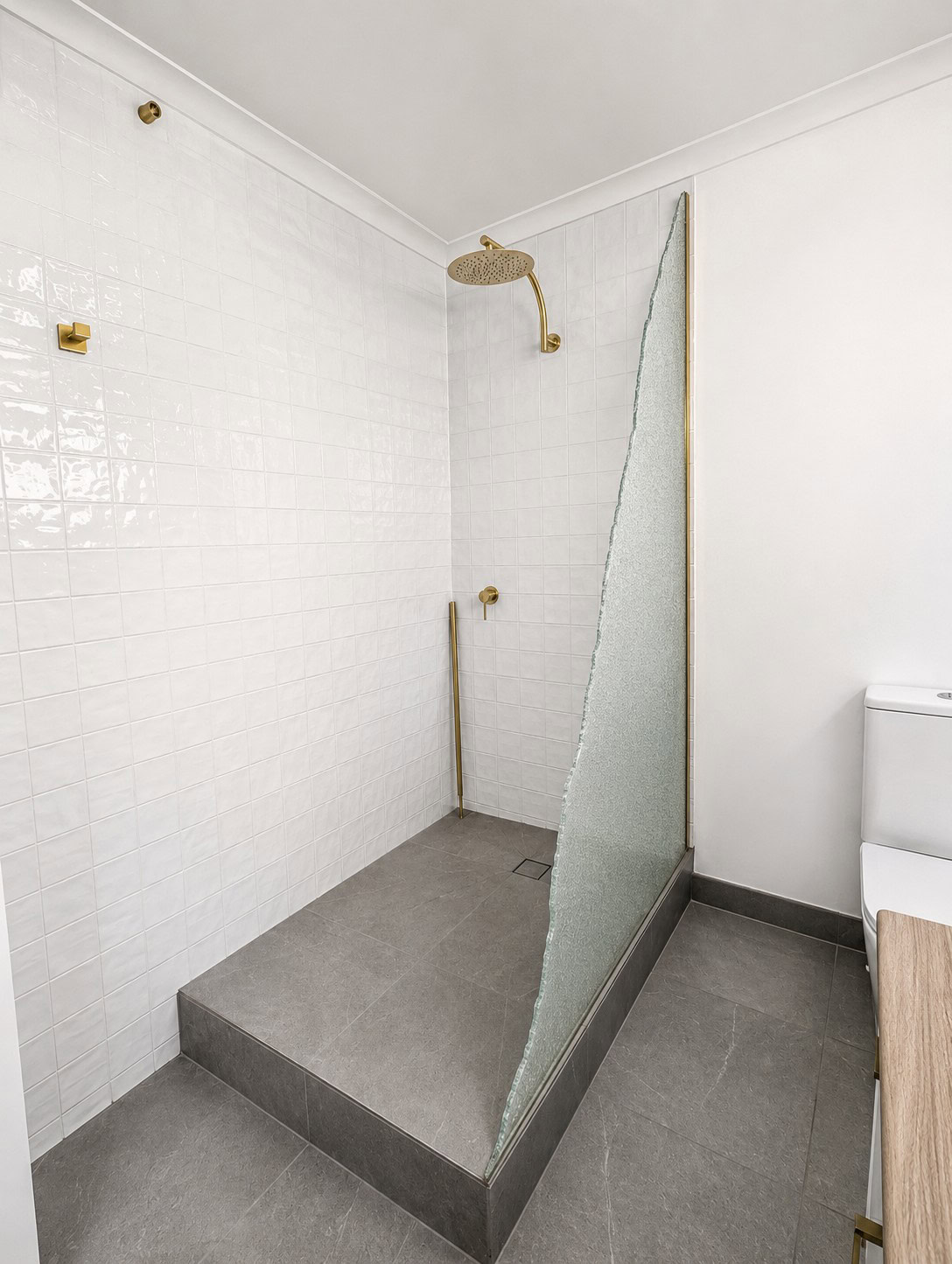 Shattered shower screen glass in Clifton Hill before replacement