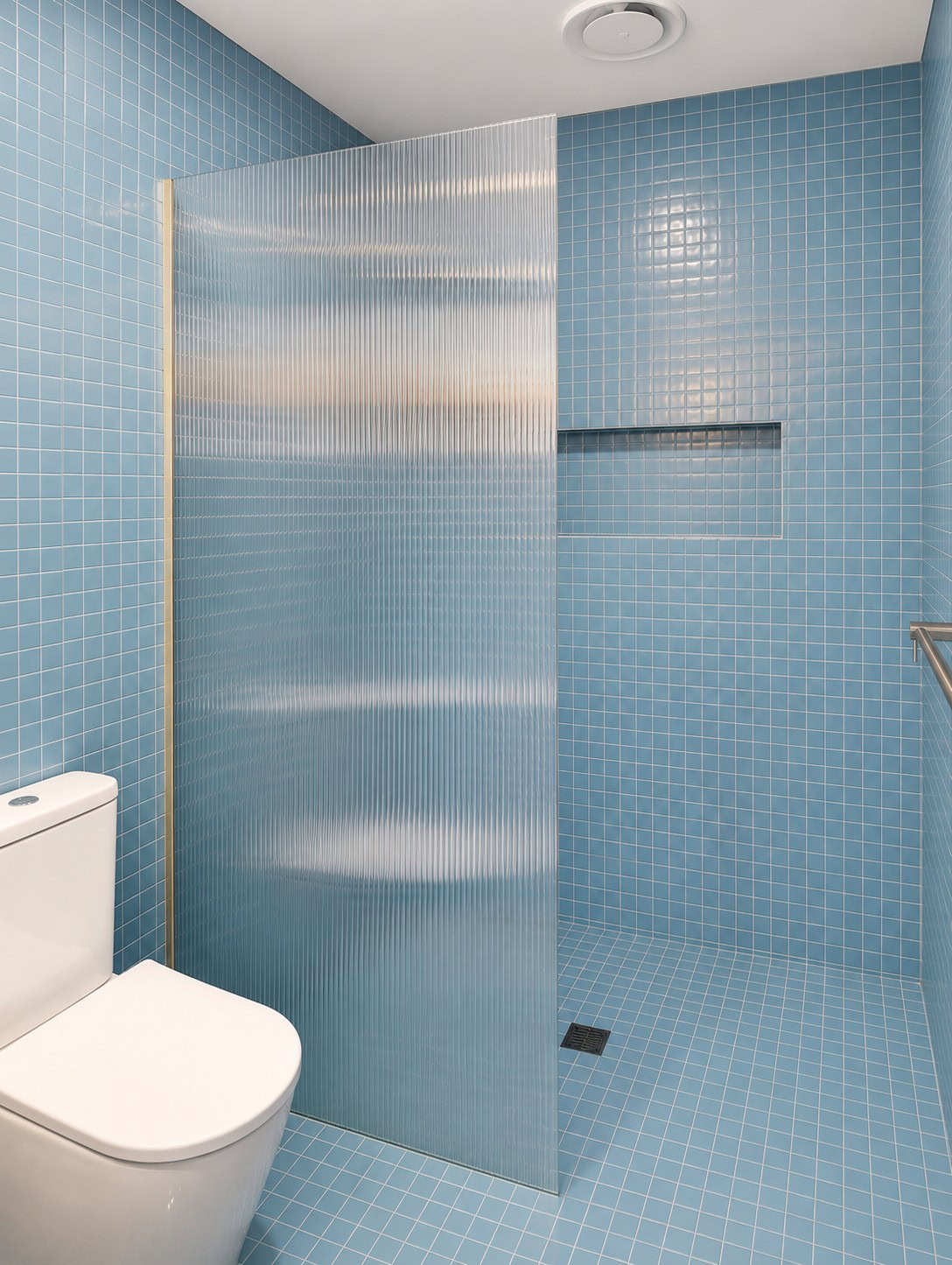 Walk in shower screen with reeded glass panel installed in Yarraville bathroom