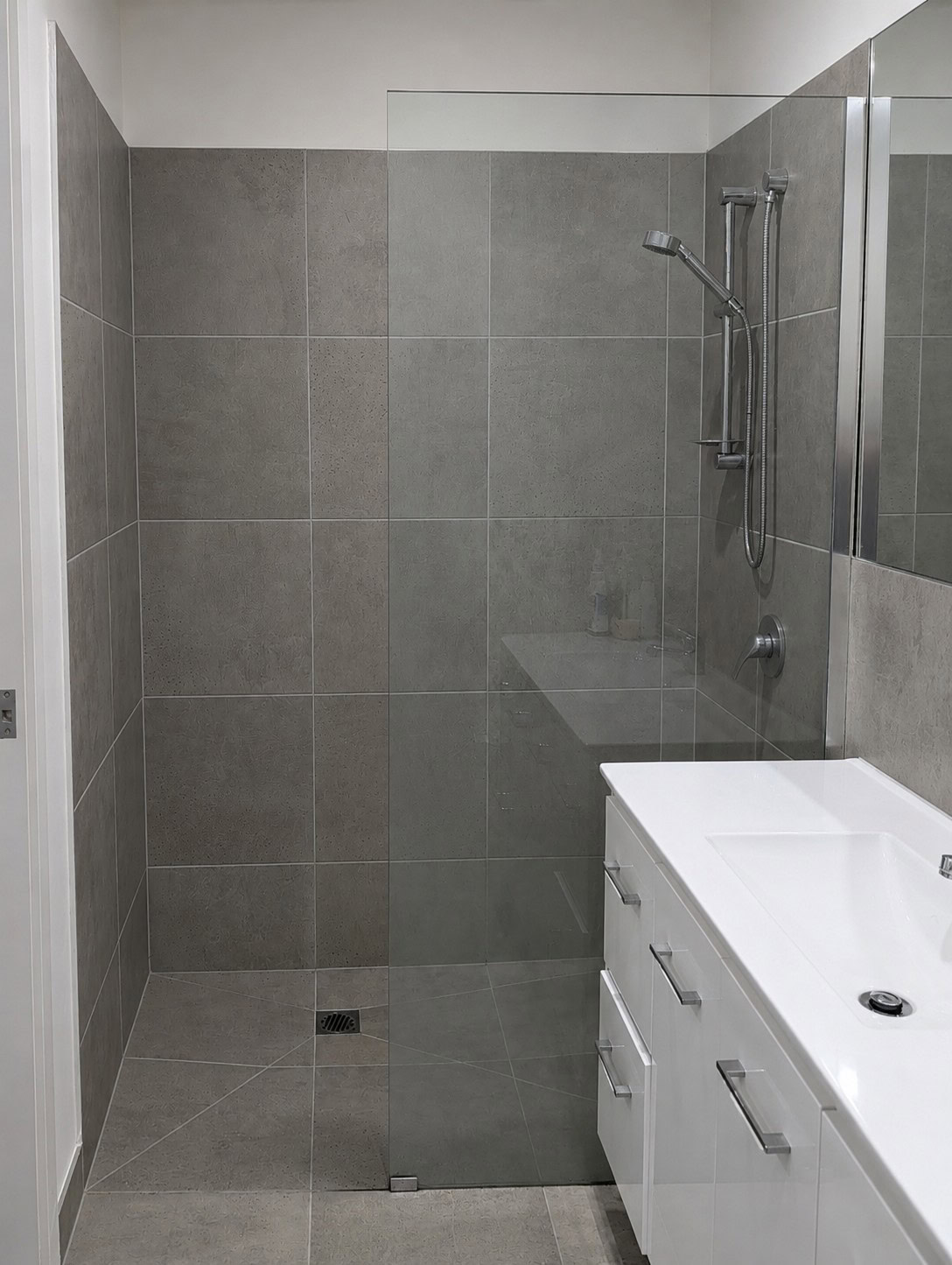 Existing walk in shower screen panel in Delahey before replacement