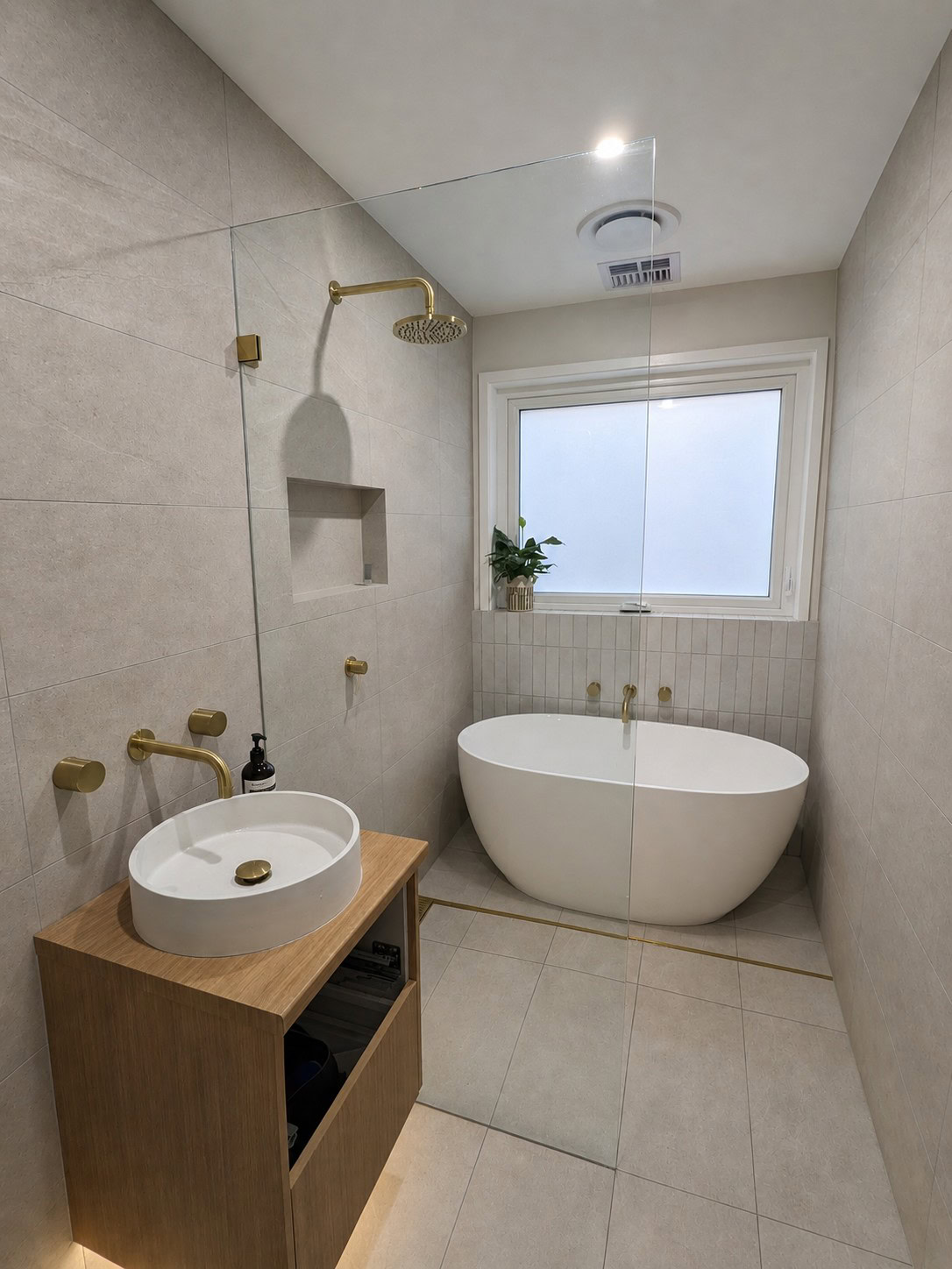 Frameless walk-in shower screen with fixed glass panel installed in Yarraville bathroom
