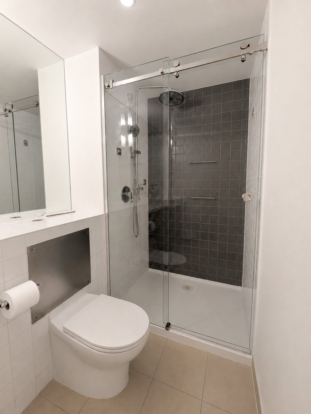 Chrome frameless sliding shower screen installed in Footscray apartment bathroom
