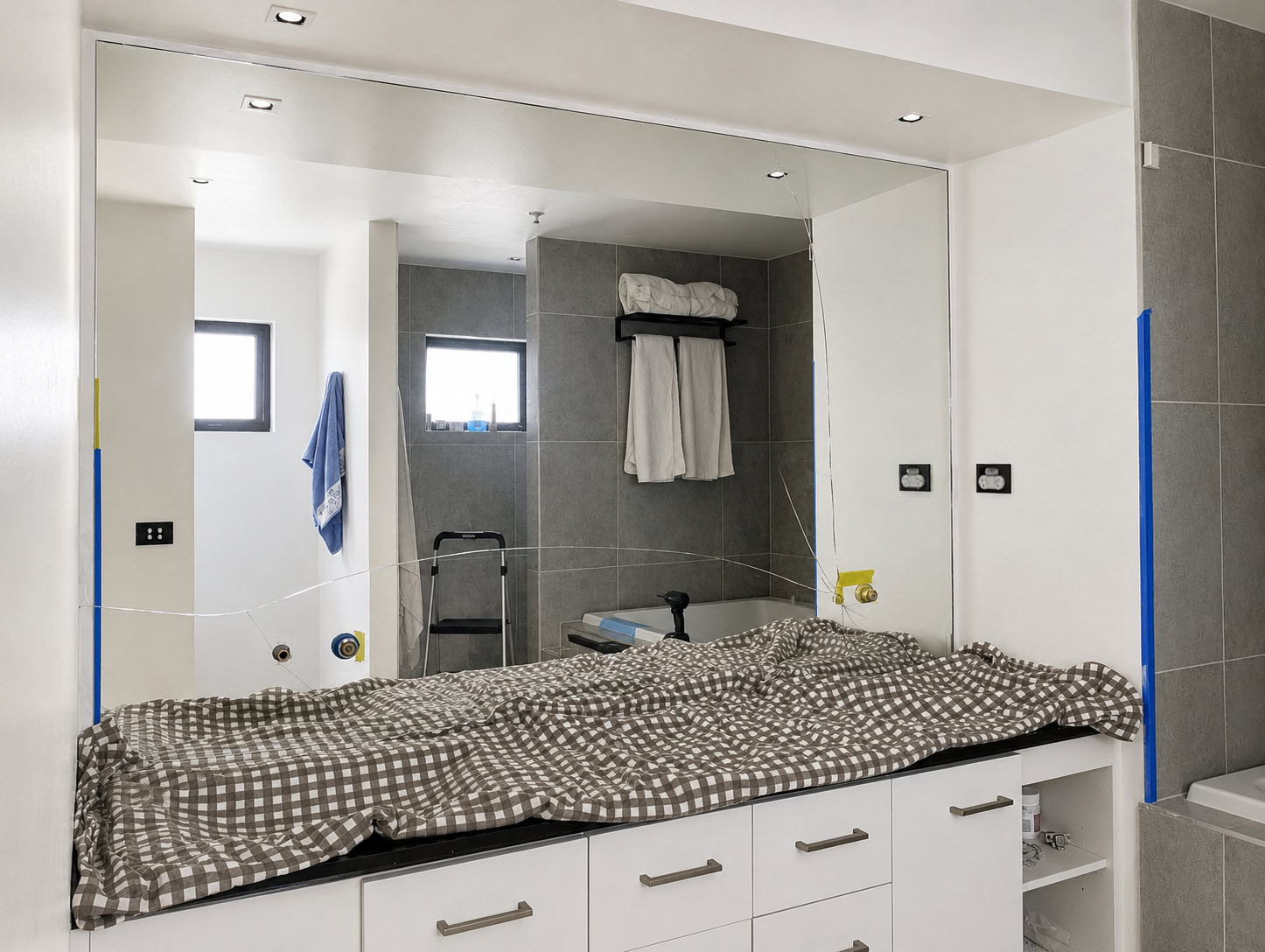 Cracked full height mirror splashback with tap cut outs in Lower Templestowe