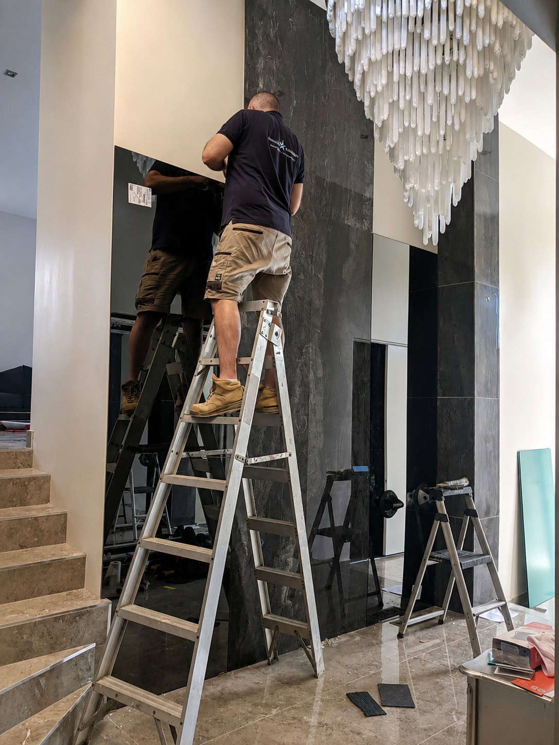 Feature wall before custom grey mirror installation in Point Cook
