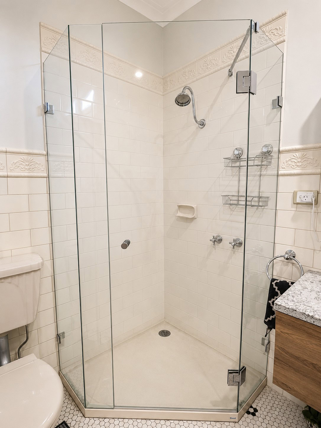 Tall frameless diamond shape shower screen replacement in Essendon bathroom
