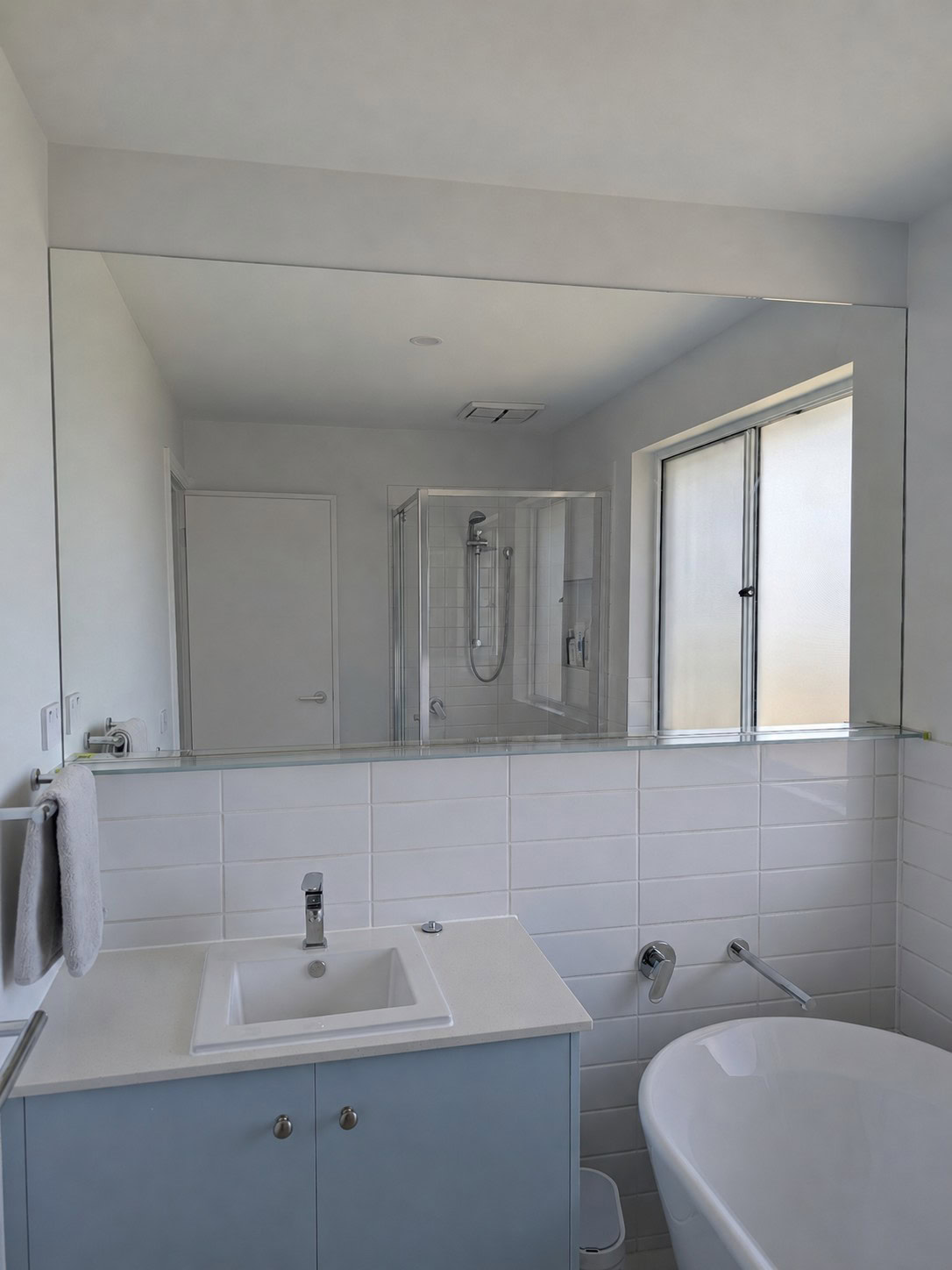 Full width bathroom mirror installed in Sunbury new home