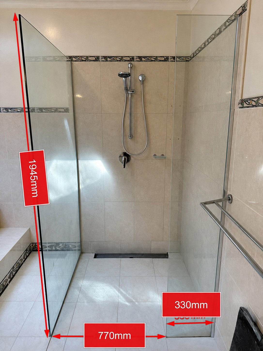 Existing fixed glass shower screen in Eltham bathroom before replacement