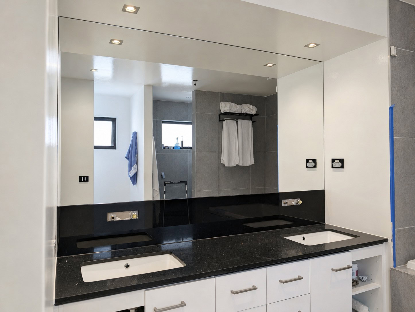 Mirror replacement with black toughened glass splashback below mirror in Lower Templestowe