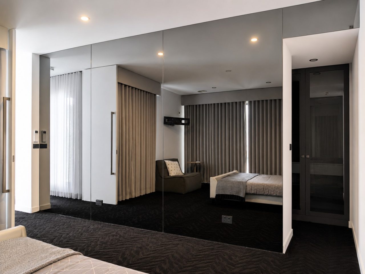 Custom grey mirror feature wall installed in Sanctuary Lakes