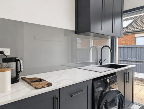 Grey painted glass splashback installed in a Tarneit laundry